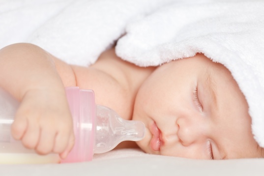 Sleeping baby with bottle
